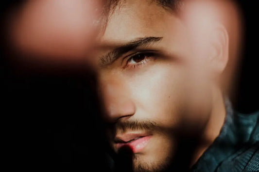 A man with intense, jealous eyes, his envy seemingly triggered by someone authentic and genuine