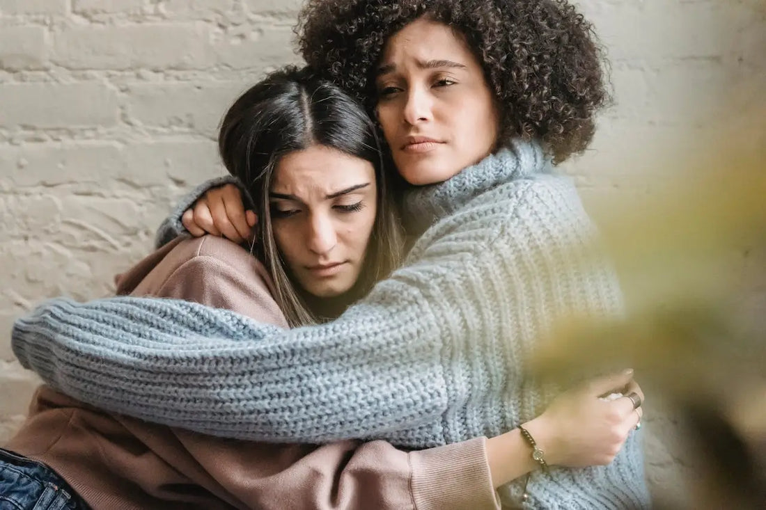 two women hugging each other like empath not dark empath
