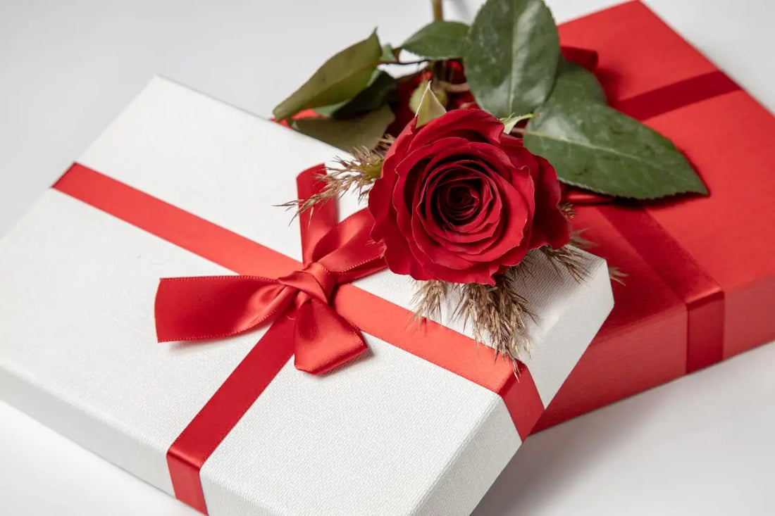white and red gift boxes with red rose