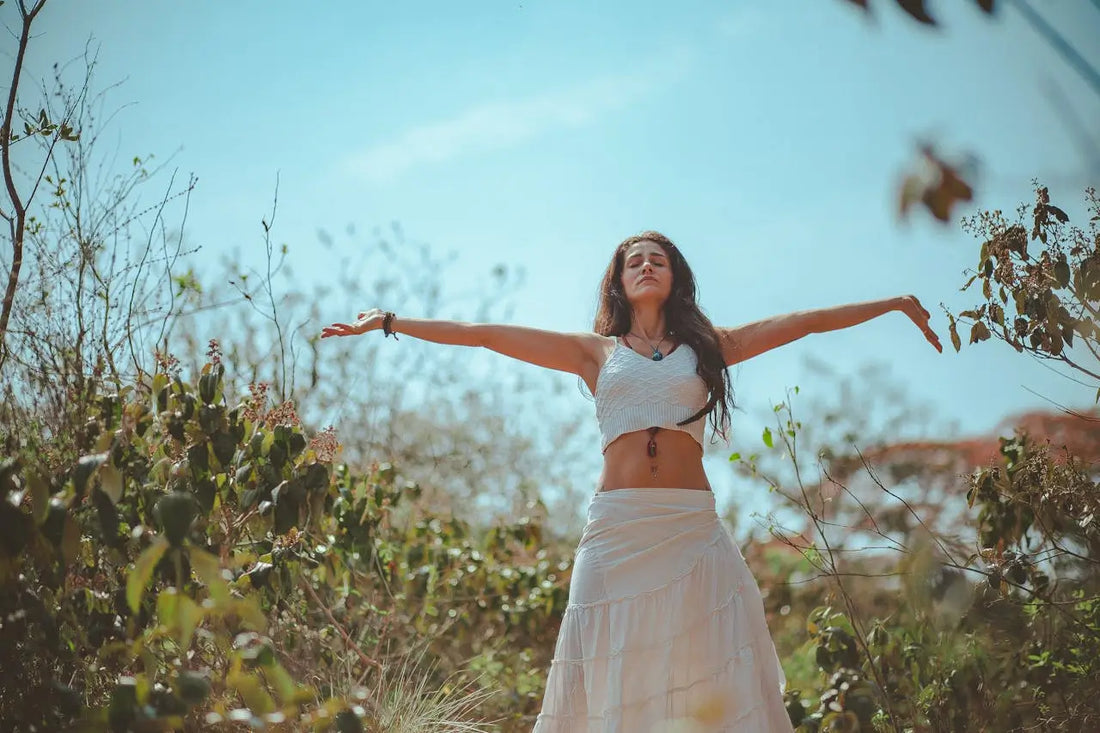 woman spreading her arms wide as if she knows herself truly