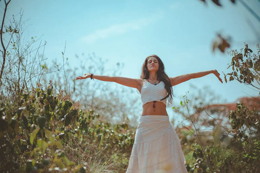 woman spreading her arms wide as if she knows herself truly